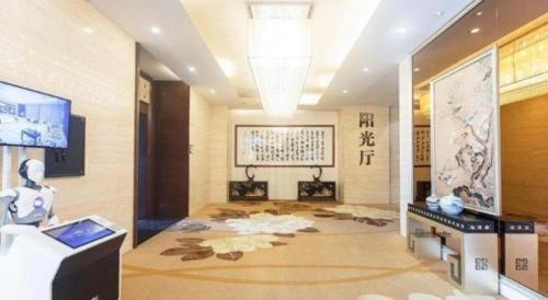 a room with a chinese room with a large room with at Wuhan Soluxe Hotel in Wuhan
