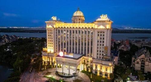 a large building with a dome on top of it at Auspicious Hotel in Zhongshan