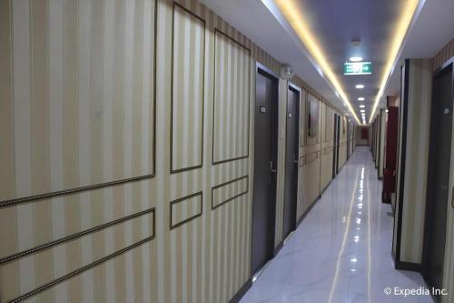 a hallway of a hospital with a long corridor at Horizon Hotel in Olongapo