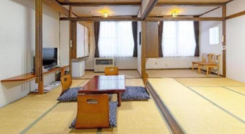 TV a/nebo společenská místnost v ubytování Yunosawa Onsen Mori no Shiki