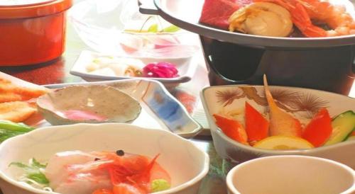 a group of bowls of food on a table at Otaiko Hills in Fukui