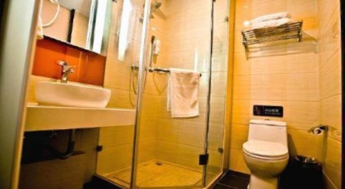 a bathroom with a shower and a toilet and a sink at 7 Days Premium Beijing Dabaotai Metro Station Luhua Road in Beijing