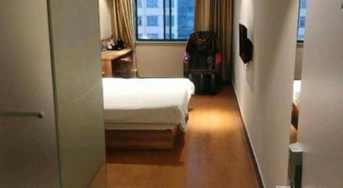 Postel nebo postele na pokoji v ubytování Shanghai Jiejia hotel