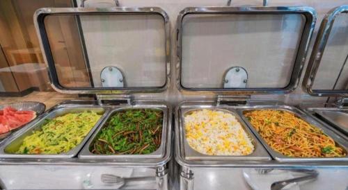 three trays filled with different types of food at Shell Hotel Wuhu Jiujiang District Daqiao Town Huashan Road in Wuhu