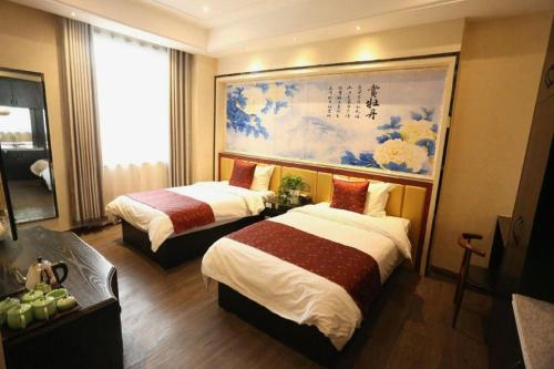 Postel nebo postele na pokoji v ubytování PAI Hotels Shijiazhuang Zhengding Gucheng