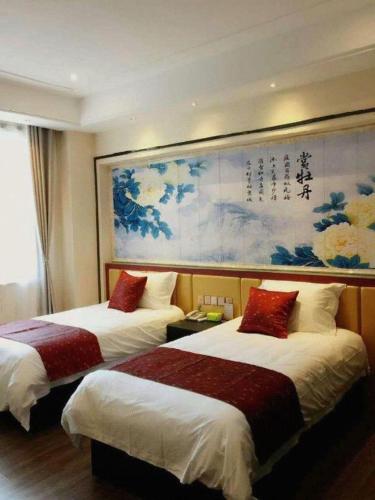 Postel nebo postele na pokoji v ubytování PAI Hotels Shijiazhuang Zhengding Gucheng