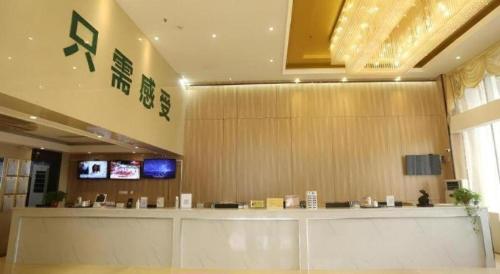 a lobby with a cash counter in a building at GreenTree Inn Anqing Yingbin Dong Road High-Speed Railway Station in Anqing