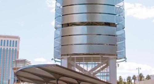 a tall glass building with a curved roof at OYO Gateway Motel Las Vegas North Strip/Fremont St. Area in Las Vegas