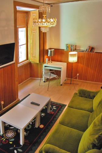 a living room with a couch and a table at Norte Guest House in Lisbon