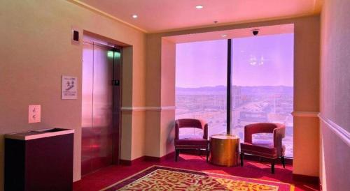 a room with chairs and a view of the canyon at Ahern Hotel and Event Center in Las Vegas