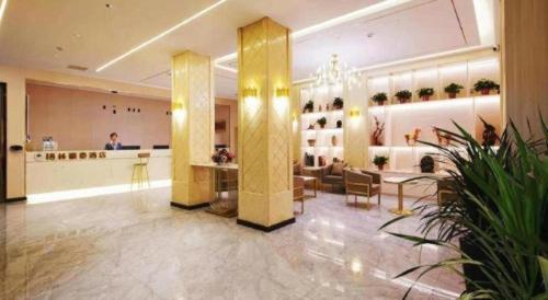 a lobby of a store with a counter and chairs at GreenTree Inn Luoyang Henan University of Science and Technology in Luoyang