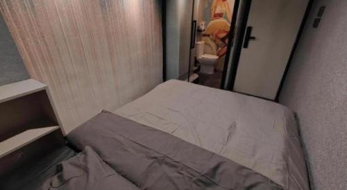 Ένα ή περισσότερα κρεβάτια σε δωμάτιο στο Where Inn