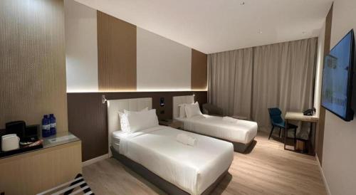 Кровать или кровати в номере J HOTEL