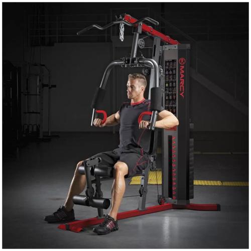 a man sitting in a chair in a gym at Brand new 5 star category home at RedHead beach in Redhead