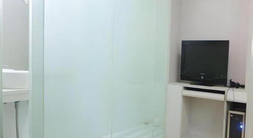 TV a/nebo společenská místnost v ubytování Wanxiang Hotel