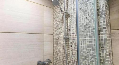 a shower in a bathroom with a building at Metroplace Boutique in Hong Kong