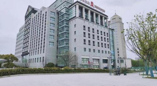 a group of tall buildings in a city at Jinjiang Inn Jiaxing South Lake in Jiaxing