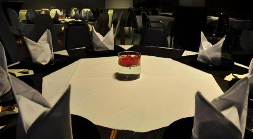 a table with a glass on top of a table at Piyaporn Hill Paradise Hotel in Mae Sai