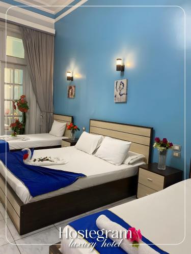 Cama o camas de una habitación en Host Hotel