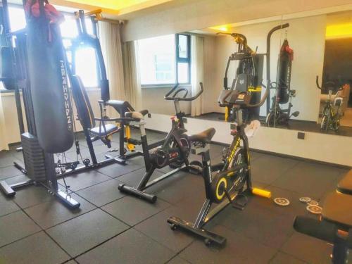 a gym with several exercise bikes in a room at Yanji Yanbian International Hotel in Yanji
