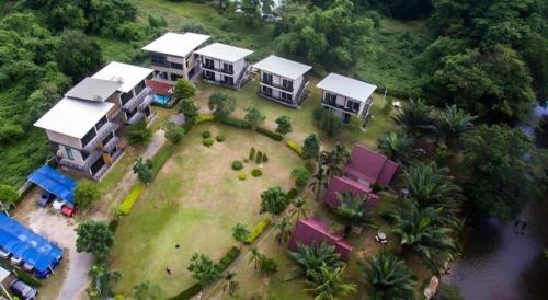 an aerial view of a house with a yard at Ma-Kham Forest Resort in Nakhon Nayok