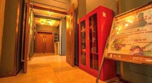 a hallway of a building with a sign on the wall at Jinjiang Inn Style Shenyang The Palace Huaiyuan Gate in Shenyang