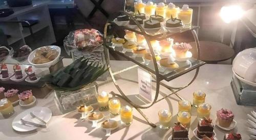 a display of desserts and pastries on a table at CK Tanjungpinang Hotel and Convention Centre in Tanjung Pinang 