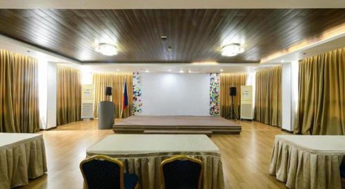 a large room with a stage in the middle of it at Eighty Eight Hotel in Koronadal