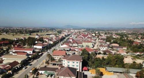 an aerial view of a small town with buildings at Favanhmai Hotel in Muang Phônsavan