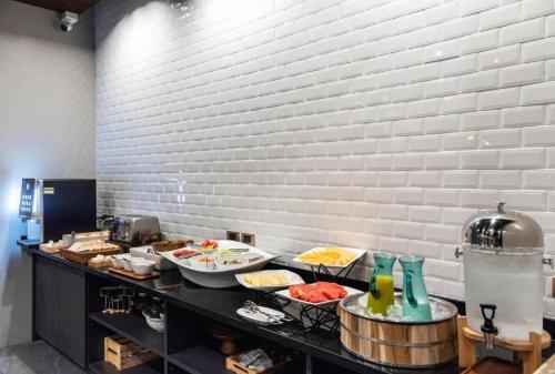 a buffet with many plates of food on a table at XOTEL in Khon Kaen