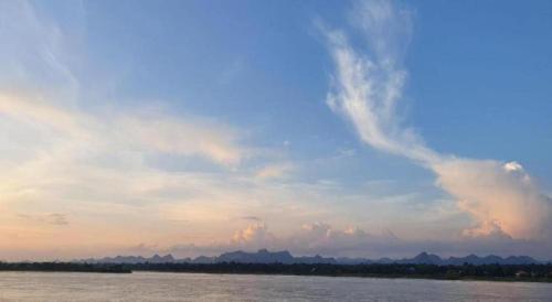 a cloudy sky over a body of water at THE S VILLAS HOTEL in Nakhon Phanom