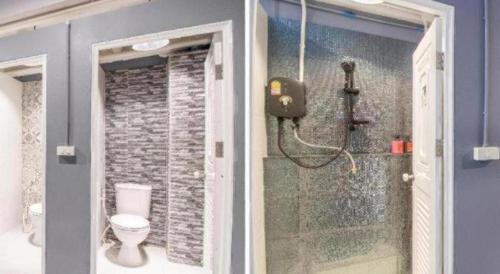 a bathroom with a shower and a toilet in it at OYO 726 Sookjai Cafe and Hostel in Chiang Mai