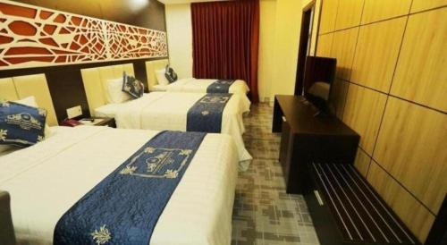 Postel nebo postele na pokoji v ubytování Tuong Minh Hotel
