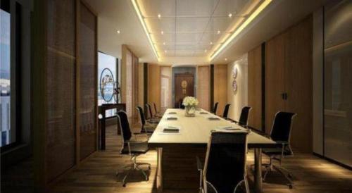 a conference room with a long table and chairs at Chambery Hotel in Zhuhai