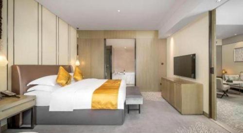 Postel nebo postele na pokoji v ubytování ZHONG DING HOTEL