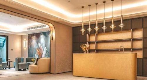 a lobby of a hotel with a reception desk at Emerald Bay Hotel in Yuxi