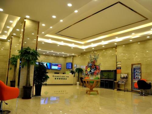a lobby of a shopping mall with a large room with a lobby at GreenTree Inn Haixi Geermu Southern suburbs Express Hotel in Golmud