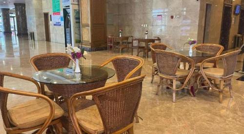 a group of chairs and tables in a restaurant at Datong Tiangui International Hotel in Datong