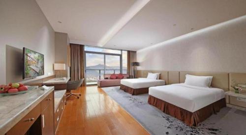 Katil atau katil-katil dalam bilik di Fliport Hotel Zhangzhou Yuanshan