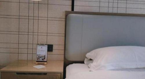 Cama o camas de una habitación en Echarm Hotel Jinan Railway Station Daming Lake