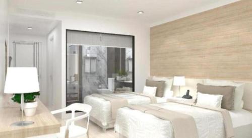 a white bedroom with two beds and a couch at Thaisun Bangkok Hotel in Bangkok