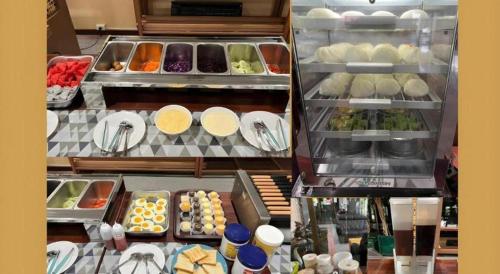 a display case with many different types of food at Hihotel Saraburi in Sara Buri