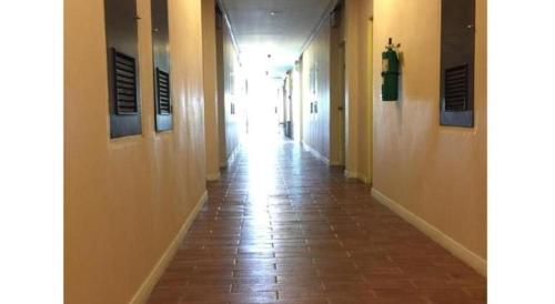 an empty hallway with a long corridor at Cactus Resort & Hotel in Khon Kaen