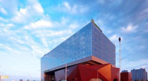 a large building with a lot of windows on it at Holiday Inn Express Handan East By IHG in Handan