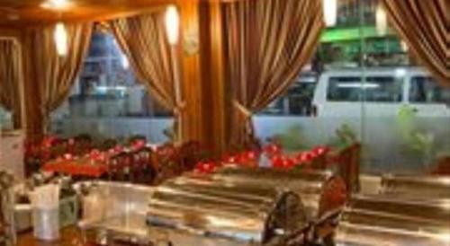 a view of a restaurant kitchen with red food at Asia Hotel in Phnom Penh