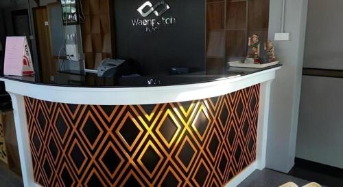 a store counter with a display in a room at Waenpetch place Hotel in Ubon Ratchathani