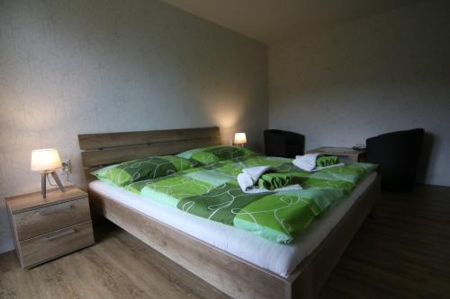 Posteľ alebo postele v izbe v ubytovaní Penzión Sibír