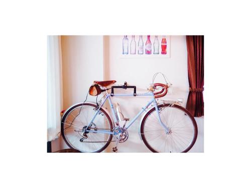 a bike is parked in a room at Retro Twin Home @Maesot in Mae Sot