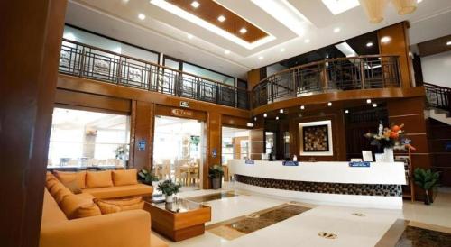 a living room with a couch and a lobby at Subic Grand Harbour Hotel Subic Bay in Olongapo