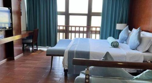 Postel nebo postele na pokoji v ubytování Man Wan Harmona Resort